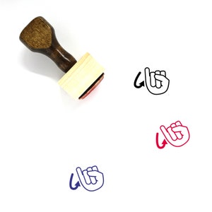 May include: Wooden stamp featuring a hand forming the letter "L" in British Sign Language. The stamp is brown with a light wood base. The hand is depicted in black, red, and blue.