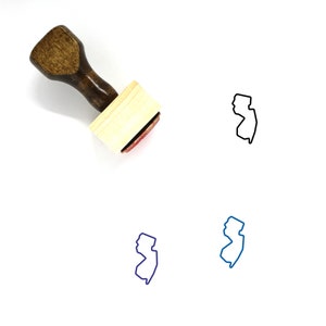 May include: A wooden rubber stamp with a handle and a rectangular base. The stamp features an outline of the state of New Jersey. The stamp is shown on a white background.