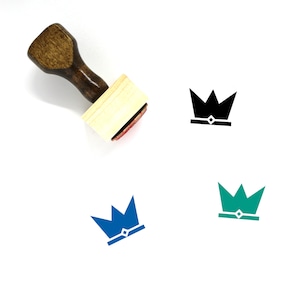 May include: A wooden stamp with a crown design. The crown is shown in black, blue, and green.