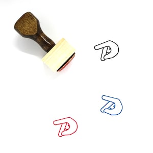 May include: A wooden rubber stamp with a brown handle and a rectangular wooden base. The stamp features a black outline of a hand making a pinching gesture. The stamp is shown on a white background.