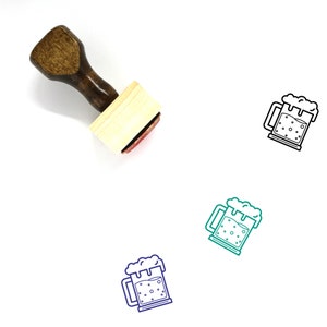May include: A wooden rubber stamp with a handle and a rectangular base. The stamp features a line drawing of a beer mug with foam on top.
