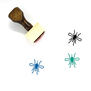 May include: Wooden rubber stamp with a black, blue, and green mosquito design. The stamp is mounted on a wooden handle.