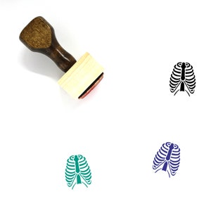 May include: A wooden rubber stamp with a brown handle and a rectangular wooden block. The stamp features a black silhouette of a ribcage.