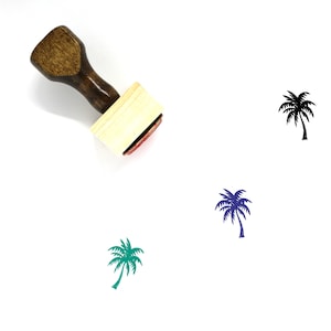 Puede incluir: Un sello de goma de madera con un diseño de palmera. El sello está sobre un fondo blanco. La palmera se muestra en negro, verde y azul.