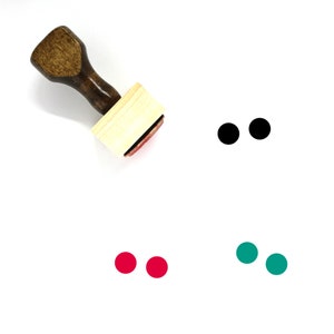 May include: A wooden stamp with a black handle and a rectangular wooden block. The stamp is used to create three sets of two black, red, and green dots.