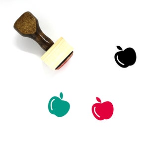 May include: A wooden stamp with a red ink pad. The stamp features a black apple icon. There are also green and red apple icons in the image.