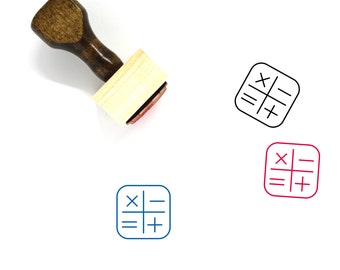May include: Wooden stamp with a square design featuring the symbols for addition, subtraction, multiplication, and division. The stamp is on a white background.
