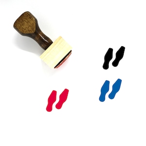 May include: A wooden stamp with a red ink pad. The stamp features a design of two footprints. The footprints are shown in black, blue, and red.