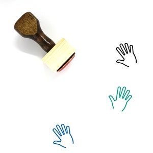 May include: A wooden hand stamp with a brown handle and a light-colored rectangular base. The stamp has a red ink pad. Three hand outline illustrations in black, teal, and blue are also present.
