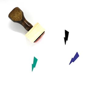 May include: A wooden stamp with a red ink pad and a lightning bolt design. The stamp is shown with three different colored impressions of the lightning bolt design.