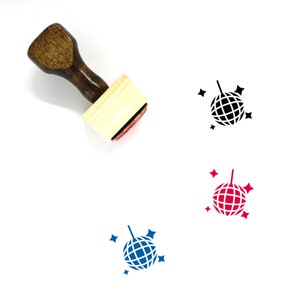 May include: A wooden stamp with a brown handle and a light-colored base. The stamp's imprint is a disco ball design, shown in black, red, and blue, each with star accents. The stamp is on a white background.