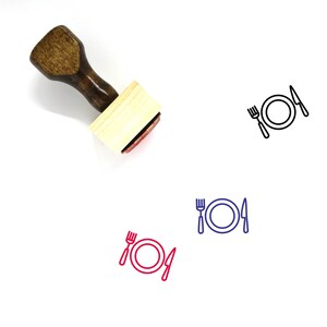 May include: Wooden rubber stamp with a handle and a square base. The stamp features a red outline of a plate, fork, and knife.