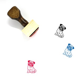 May include: Wooden rubber stamp with a brown handle and a rectangular base. The stamp features a black and white illustration of a pug dog sitting.