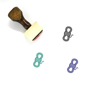 May include: A wooden rubber stamp with a rope design. The stamp is brown with a red ink pad. The rope design is shown in black, green, and blue.