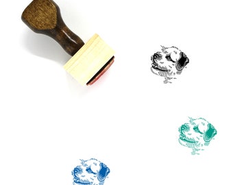 May include: A wooden rubber stamp with a brown handle and a rectangular wooden block. The stamp features a black and white line drawing of a Border Terrier dog's head.