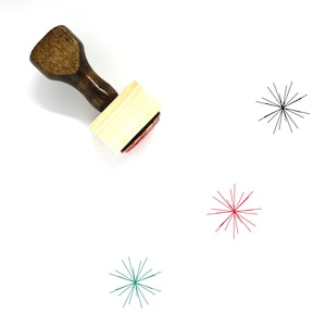 May include: A wooden stamp with a handle and a square base. The stamp has a red ink pad and a design of a starburst with radiating lines. Three starburst designs are shown in black, red, and teal.