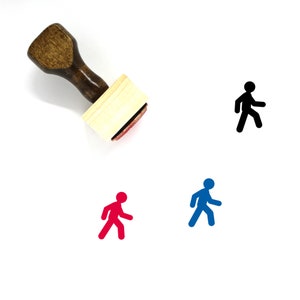 May include: A wooden stamp with a handle and a rectangular ink pad. The ink pad is red and has a walking person icon on it. There are three walking person icons below the stamp, one black, one blue, and one red.