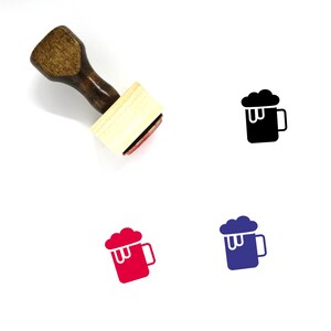 May include: A wooden rubber stamp with a handle and a square base. The stamp features a black silhouette of a beer mug with foam on top.