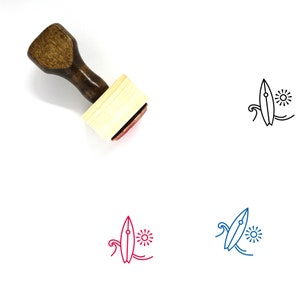 May include: Wooden stamp with a brown handle and a rectangular wooden block. The stamp features a line drawing of a surfboard with a wave and sun.