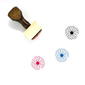 May include: Wooden stamp with a handle and a square base. The stamp features a red daisy design.