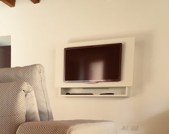 Wall-mounted TV cabinet with sound bar arrangement and cable passage