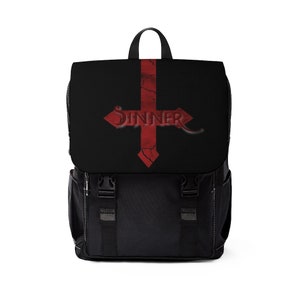 May include: Black backpack with a red, cracked cross design and the word "SINNER" in a gothic font. The backpack has a top handle, two front pockets, and adjustable straps. White stitching accents the edges.