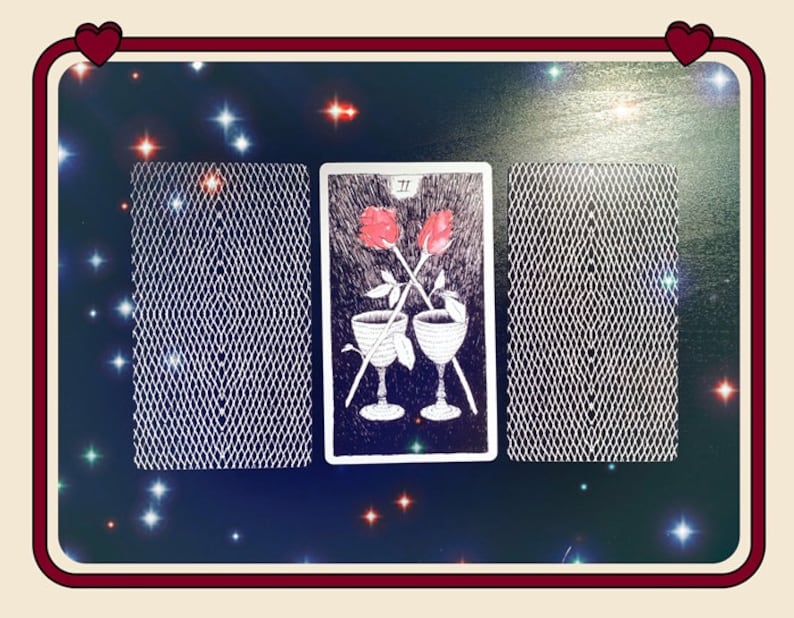 May include: Two crossed wands with red roses on top, and two goblets with red liquid, on a black and white tarot card with the number "II" in the top left corner.