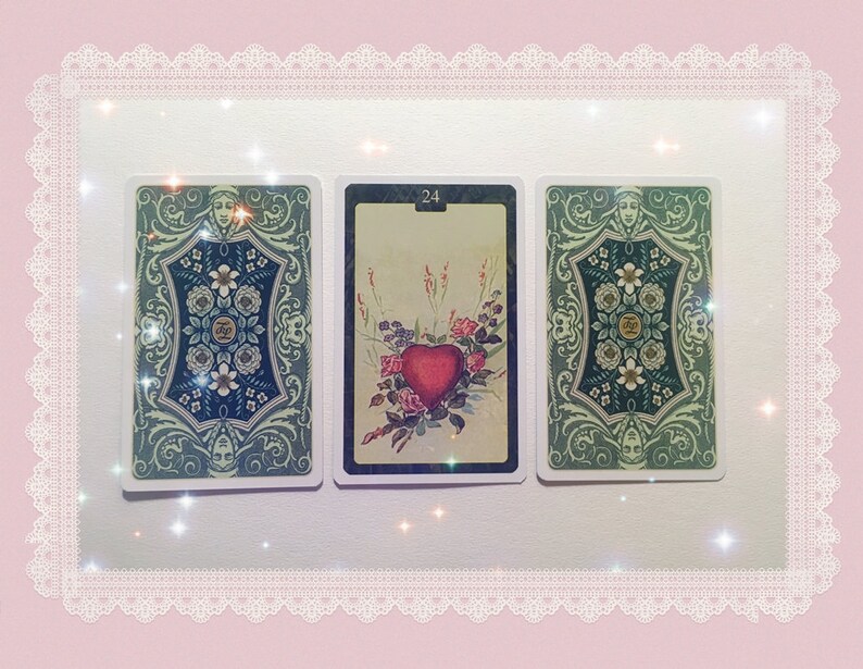 May include: Three tarot cards with ornate green and blue borders. The card on the left has a number "0" in the center. The card in the middle has the number "24" in the center and a red heart with flowers. The card on the right has a number "0" in the center.