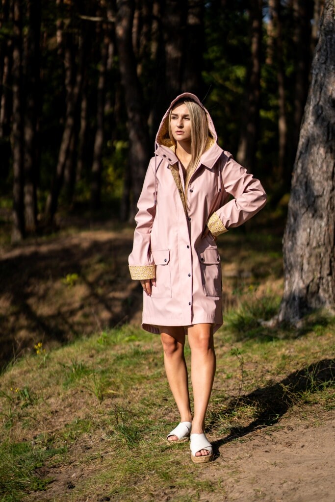 Stylish Plastic Raincoat. Women 