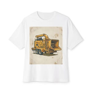 May include: White t-shirt featuring a yellow wood chipper graphic with the word "CHIPPY" and a smiling face. The wood chipper is on a trailer with two wheels. The graphic has a vintage, distressed look.