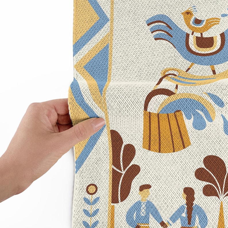 May include: Close-up of a patterned fabric with a folk art design. The design features a blue bird, a wooden bucket, and figures in blue clothing. The fabric has a cream background with blue, yellow, and brown accents.