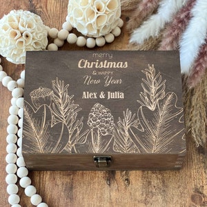 May include: A wooden box with a hinged lid and a latch. The box is decorated with a floral design and the text "merry Christmas & happy New Year Alex & Julia".