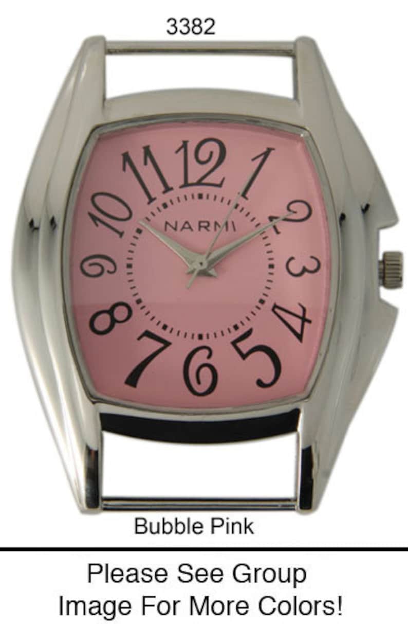 May include: A silver watch with a square face and a pink dial. The watch has black Roman numeral hour markers and a black second hand. The watch face also has the word "NARMI" printed on it.