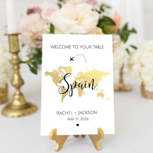 Bewerkbare reisthema tabelnamen sjabloon, gouden wereldkaart tabelnummers, reisthema bruiloft, reisthema babyshower, tabelnummers, TT1