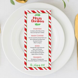 May include: A Christmas dinner menu with a red and white striped background. The menu lists starters, main course, sides, desserts, and includes the text "Merry Christmas" and "The Johnsons 202X".