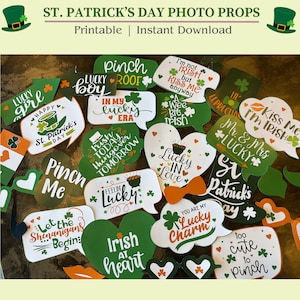 May include: A set of printable St. Patrick's Day photo booth props featuring a variety of festive designs and sayings. The props include hearts, shamrocks, and speech bubbles with phrases like "Lucky Boy", "Pinch Me", "Kiss Me I'm Irish", and "Irish at Heart".