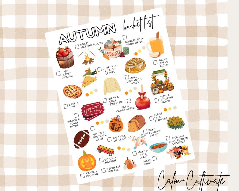 May include: A white paper with an "Autumn bucket list" in black script, featuring illustrations of fall activities like apple picking, baking a pie, and carving pumpkins. The background is a beige and white checkered pattern.