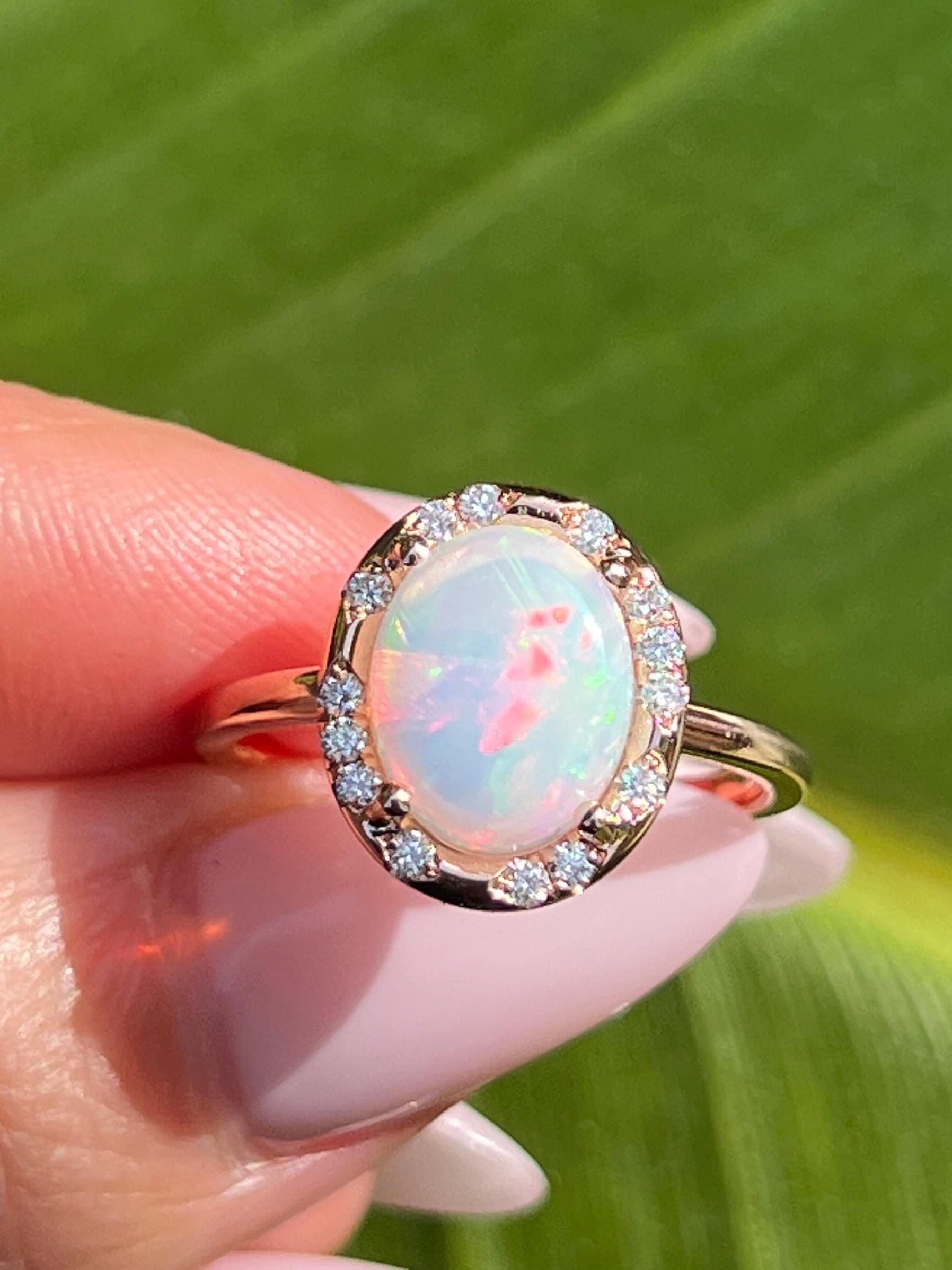 Opal ring surrounded by diamonds deals