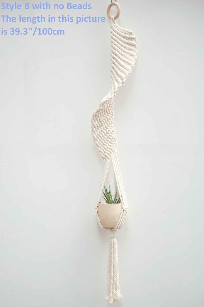 Minimalist style macrame plant hanger in Style B without beads, showcasing a clean white design measuring 100cm long, holding a small potted succulent, perfect for modern home decor.