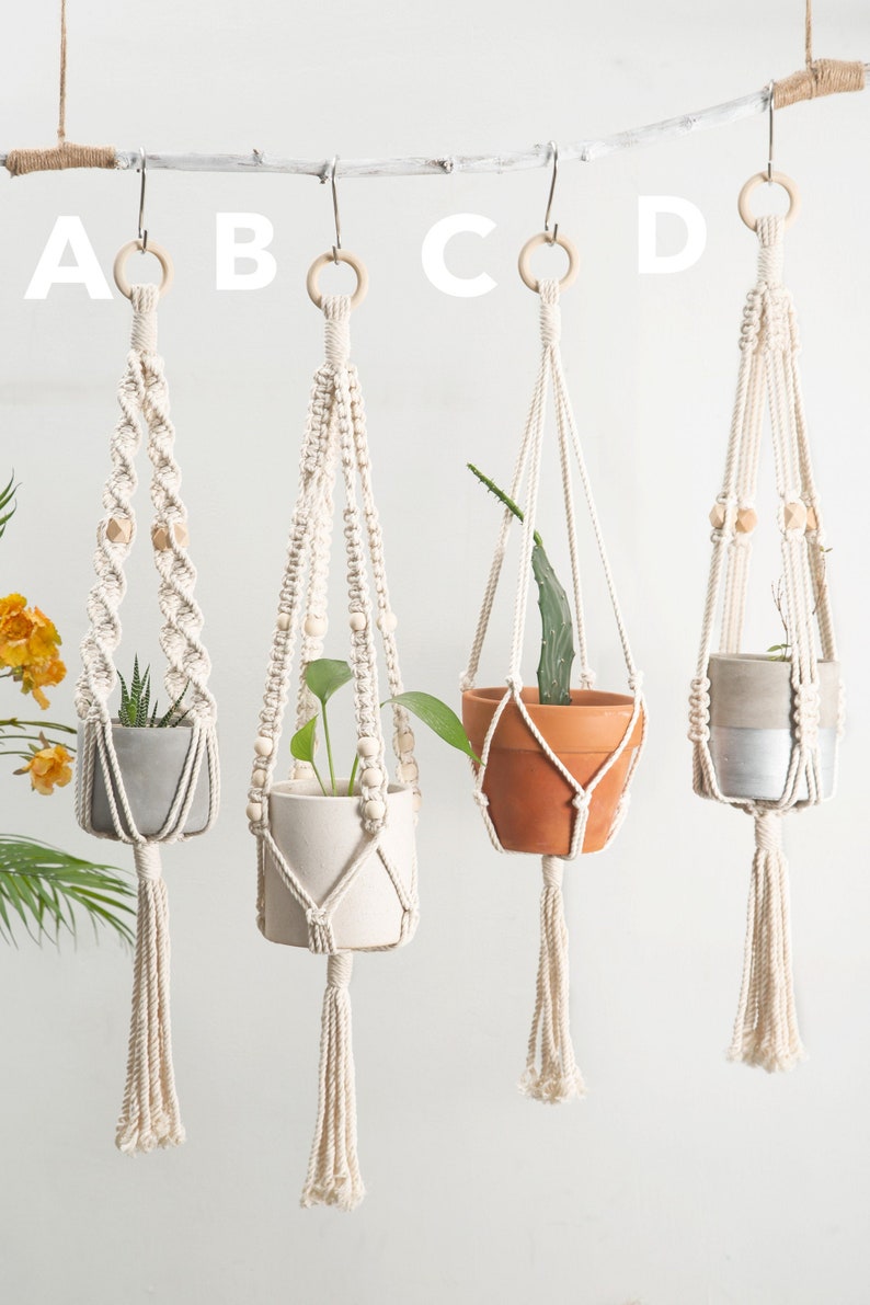 Assortment of four handmade macrame plant hangers labeled A to D, each with unique knot designs and bead embellishments, showcasing different plant types in ceramic pots, enhancing any home decor.