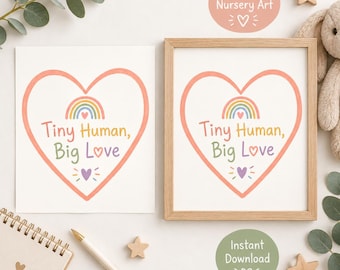 May include: Two rectangular prints featuring a large coral heart outline, a small rainbow, and the text Tiny Human, Big Love in multi-coloured lettering. One print is displayed inside a light wood frame, while the other is shown as a loose sheet.