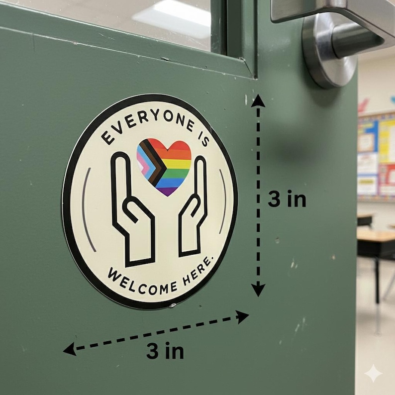 May include: A circular sticker with a cream background, black border, and black text reading EVERYONE IS WELCOME HERE. The design features two black outlined hands cupping a multicoloured heart with pride stripes. The sticker measures 7.62 cm by 7.62 cm.