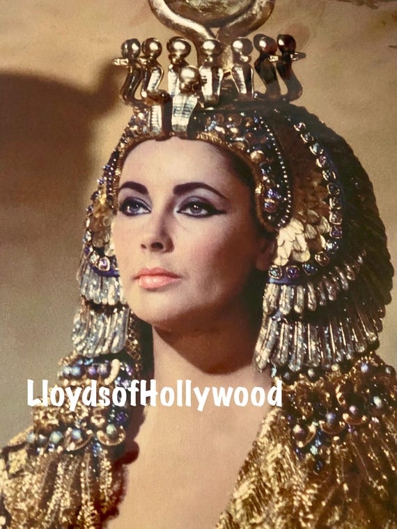 elizabeth taylor gold dress For "Cleopatra", 26.000 costumes were designed, including at least 65 outfit  changes for Elizabeth Taylor, made by Irene Sharaff. One of these included  a 24-carat gold cloth cape that was designed to