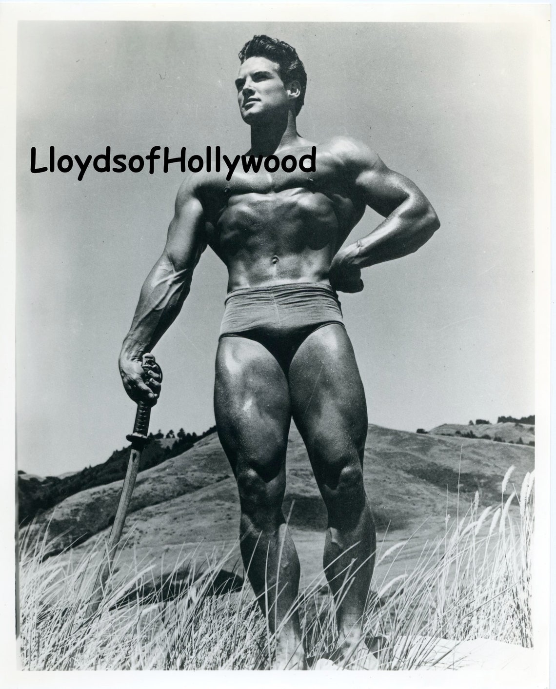 Steve Reeves Handsome Actor Bodybuilder Holding Large Sword Unique steve-reeves-handsome-actor-bodybuilder-holding-large-sword-unique