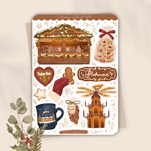 Könnte beinhalten: Ein Stickerbogen mit Illustrationen zum Thema Weihnachtsmarkt. Er zeigt einen Holzstand mit Lichtern, Lebkuchenmännern, eine Tasse mit einer Winterszene und ein Schild mit der Aufschrift "Glühwein".