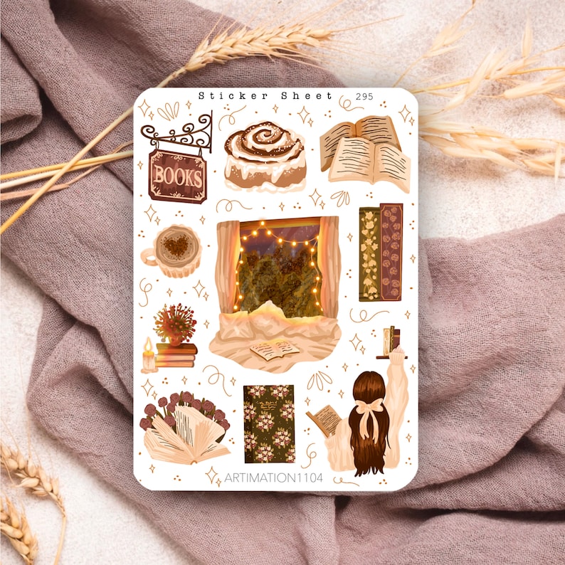 May include: A sticker sheet with a cosy autumn theme. It features illustrations of a cinnamon roll, a window with lights, a book, a cup of coffee, a bookshelf, and a person reading a book. The sticker sheet is labelled "Sticker Sheet 295" and "ARTIMATION1104".