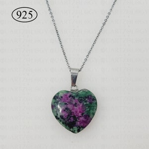 May include: A heart-shaped pendant necklace with a silver chain. The pendant is made of a green and purple stone. The text "925" is in the upper left corner. The necklace is a piece of jewellery.
