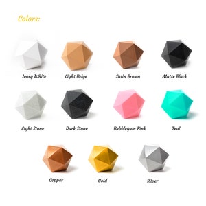 May include: A collection of 11 geometric shapes in various colors, including ivory white, light beige, satin brown, matte black, light stone, dark stone, bubblegum pink, teal, copper, gold, and silver.