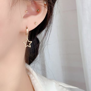 10k Solid Gold Stellar Star Drop Hoop Earrings Hypoallergenic Celestial Gift Shining and Playful Design Eye-catching Statement Piece image 3