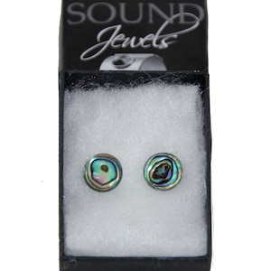 May include: A pair of iridescent abalone shell earrings in a black jewelry box with the words "Sound Jewels" printed on the lid.